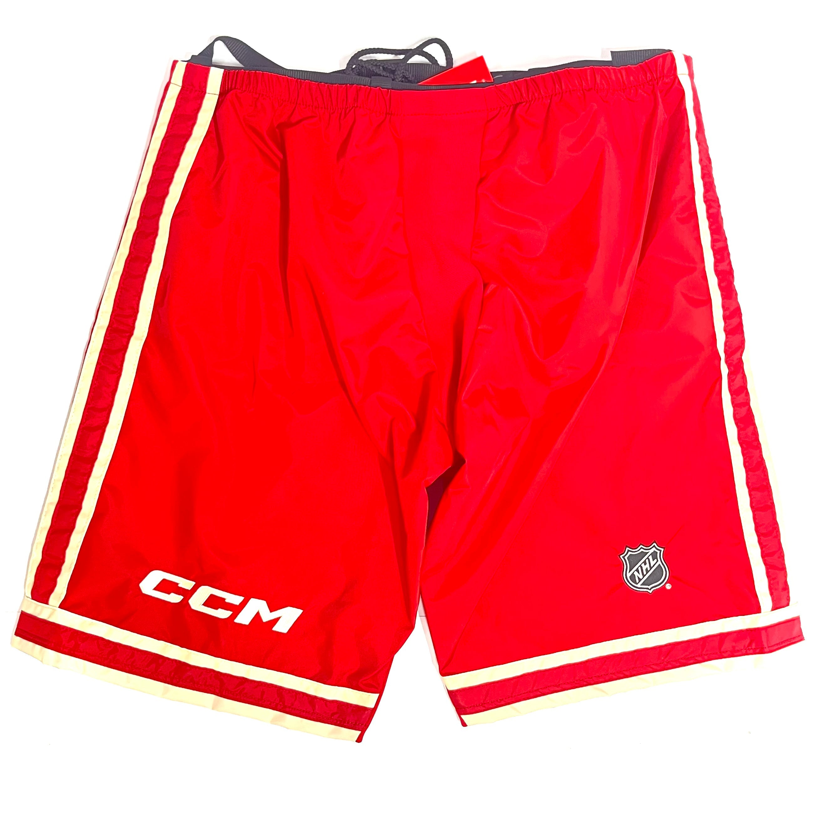 CCM PP10 - Nouvelle coque de pantalon NHL Pro Stock - Flames de Calgary (rouge/blanc)